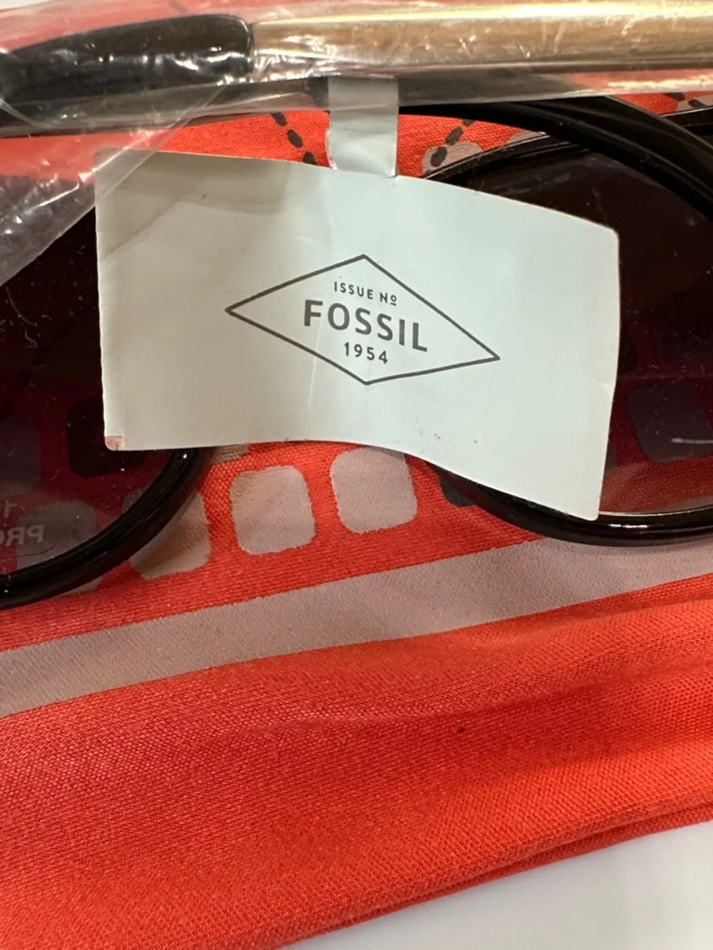 Fossil Semi Cat-Eye Sunglasses with Black & Silver Frame. 100% UV Protection